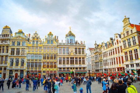 BRUSSELS, BELGIUM - OCTOBER 6, 2019: Central Grand Place square architecture, crowd of tourists, moody skyline of old townのeditorial素材
