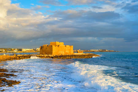 Scenic sunset seascape with clouds and Paphos Harbour Castle view, Cyprusのeditorial素材