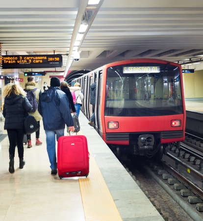 LISBON, PORTUGAL - JANUARY 28, 2020: People boarding subway train at Lisbon undeground subway staion.のeditorial素材