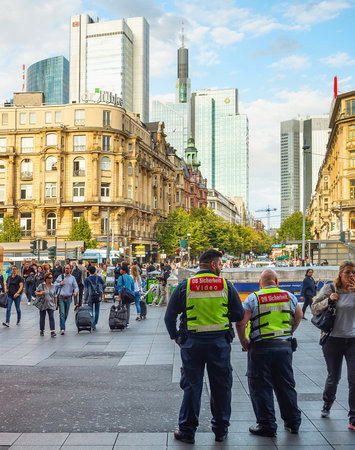 FRANKFURT, GERMANY - AUGUST 31, 2018: Central square crowded with people, skyscrapers of modern architecture, cityscape in sunset lightのeditorial素材