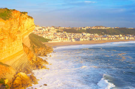 Sunset view of Nazare town - famous tourist destinaton. Portugalの写真素材