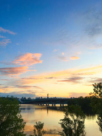 Sunset view of Dnipro river, Motherland monument and paton bridge. Kiev, Ukrianeの写真素材