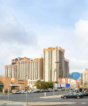 Lisbon cityscape with modern architecture by central crossroad with car traffic in downtown,...