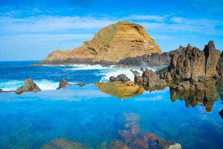 Bathes in natural lava ocean pools. Lava pools are the main attraction of Madeira.の写真素材