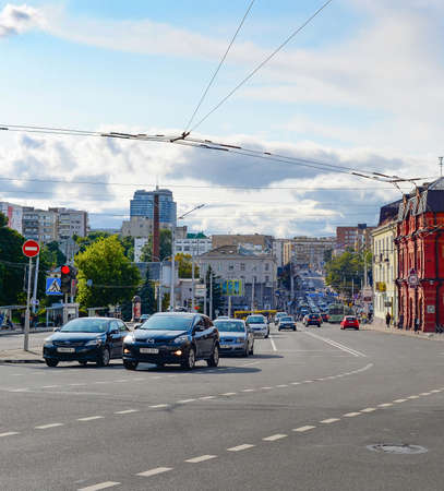 MINSK, BELARUS - JULY 17, 2019: Central street with car traffic and modern architecture in evening sunlightのeditorial素材