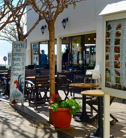 PAPHOS, CYRUS - FEB 16, 2019: Empty street restaurant with sea view at Old Town of Paphos.のeditorial素材