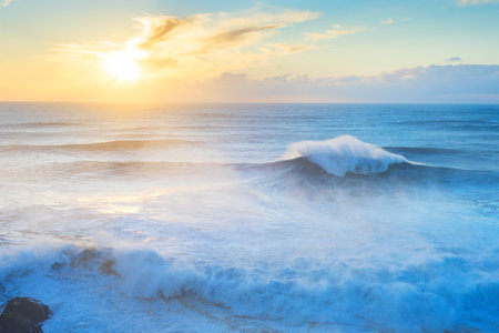 Waves at Atlantic ocean at sunset. Nazare, Portugalの写真素材