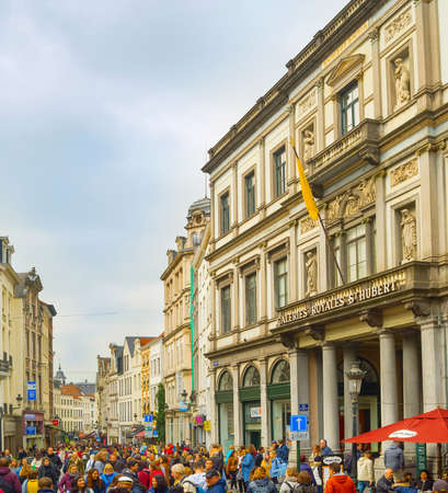 BRUSSELS, BELGIUM - OCTOBER 5, 2019: Crowd of people on Old Town street in front of the Saint-Hubert Royal Galleries - shopping arcades in Brussels, Belgiumのeditorial素材