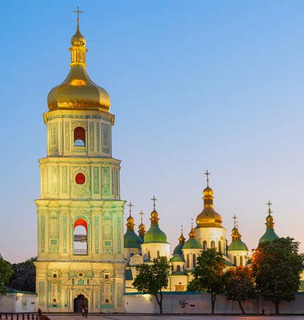 Saint Sophia's Cathedral with bell tower view at twilight, blooming chestnut trees and afterglow sky in background, Kyiv, Ukraineのeditorial素材