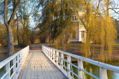 White wooden bridge to the island on a lake in Sofiyivka National Park. Uman, Ukraineの写真素材