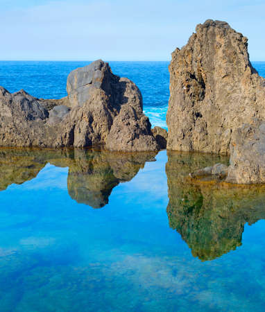 Bathes in natural lava ocean pools. Lava pools are the main attraction of Madeira.の写真素材