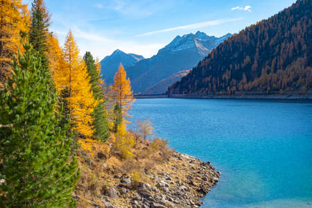 Blue river and mountains view, in sunny autumn day, Alps, Italyの写真素材