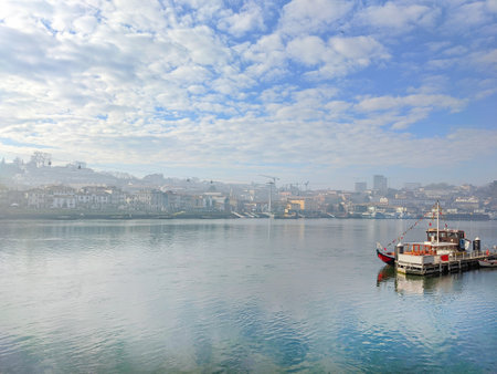 Touristic bout at Douro river, scenic cloudscape with Gaia view, Portugalの写真素材