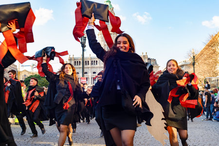 PORTO, PORTUGAL - MAY 3, 2022: Students running at traditional parade Queima das Fitas, Porto, Portugalのeditorial素材