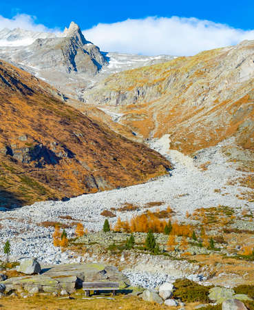 Mountain landscape with snowy peak in sunshine, Alps, Italyの写真素材
