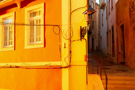 Old town curve street in susnet light, architecture of Porto, Portugalの写真素材