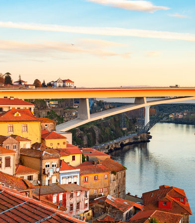 Scenic old town cityscape in sunet light with Ponte Infante Dom Henrique view, Porto, Portugalの写真素材