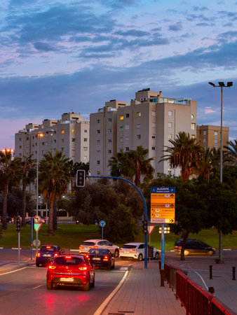 Cityscape and car traffic at sunset, street lights, Sant Joan, Alicante, Spainの写真素材