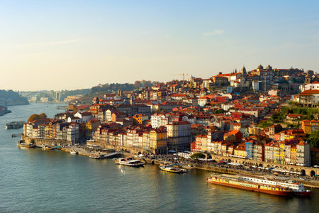 Porto cityscape with Ribeira embankment and Douro river at susnet, Portugalの写真素材
