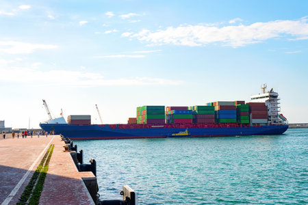 Cargo ship loaded with freight by the pier in Leixoes port, Porto, Portugalの写真素材