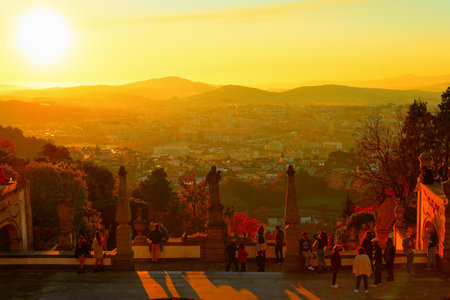 BRAGA, PORTUGAL - NOVEMBER 14, 2021: Sunset cityscape of Braga, people at the viewpoint of Bom Jesus do Monteのeditorial素材