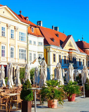 Outdoor terrace of restaurant on touristic street, Gyor, Hungaryの写真素材