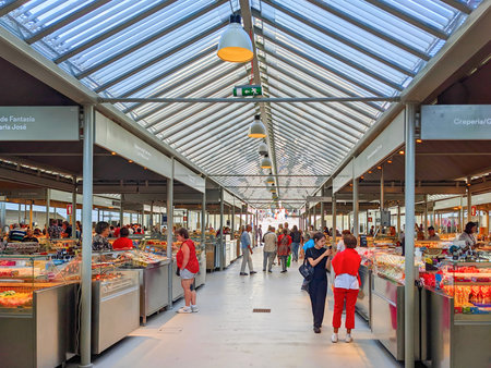 PORTO, PORTUGAL - SEPTEMBER 23, 2022: People at newly renovated famous Bolhao market in the center of Portoのeditorial素材