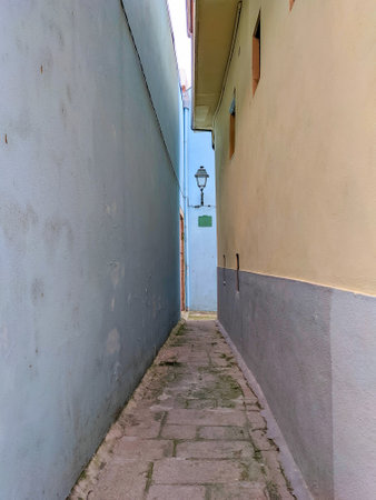 European old town narrow street with vintage lantern, Porto, Portugalの写真素材