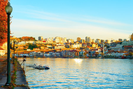 old town cityscape with traditional and architecture and Douro river and Gaia view in susnet light, vintage street lantern, Porto, Portugalの写真素材