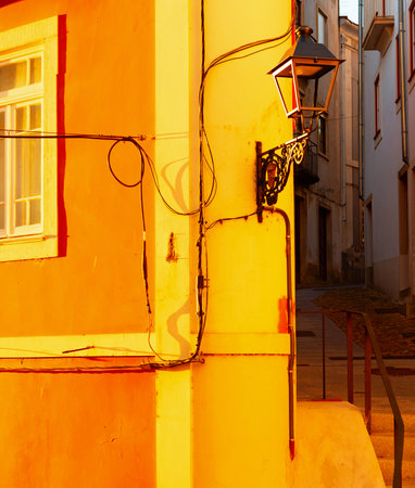 Old town curve street in susnet light, architecture of Porto, Portugalの写真素材
