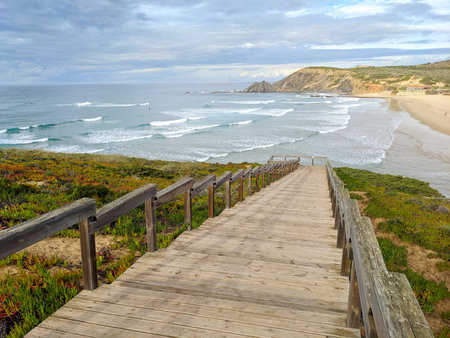 Stairs down the ocean beach. Amareira beach. Aljazur, Alentejo, Portugalの写真素材