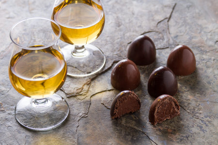 whiskey with chocolate on slateの写真素材