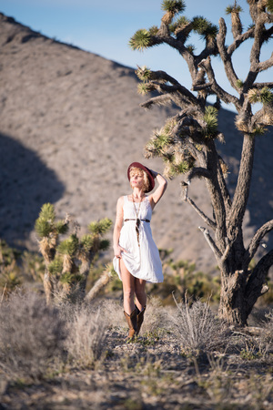 beautiful bohemian girl wearing fashion in desertの写真素材