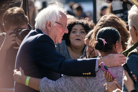 RENO, NV - October 25, 2018 - Bernie Sanders hugging attendees in crowd at a political rally on the UNR campus.のeditorial素材
