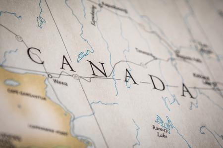 Closeup Selective Focus Of Canada On A Geographical And Political State Map Of The USA.のeditorial素材