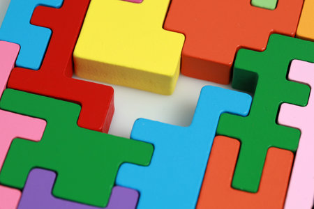 Missing a piece of colourful toy wooden block puzzle. Business concept.