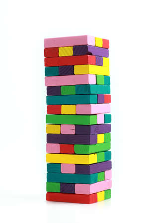 Closeup of colourful wood blocks, stack game on white background.の写真素材