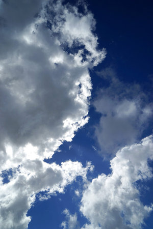 White clouds and sun in blue sky