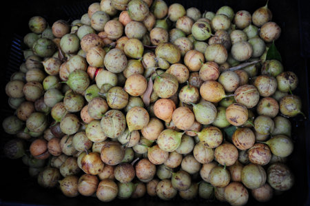 A heap of fresh nutmeg for sale at the market