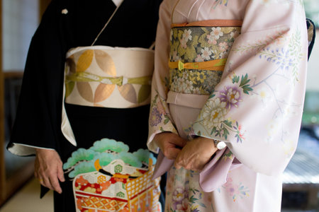 Midsection Front View Of Woman Wearing Kimono. Kimono is a traditional Japanese garment and the...
