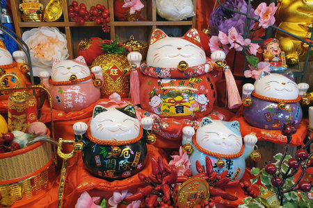 PENANG, MALAYSIA - 3 JAN 2021: Various choices of Lucky Cat or Maneki-neko display on store shelf. This is a Japanese icon that typically represents good luck, and is also known as Welcoming Cat.のeditorial素材