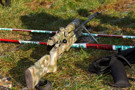 shooter aiming a rifle at a target