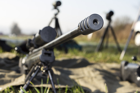 shooter aiming a rifle at a targetの写真素材
