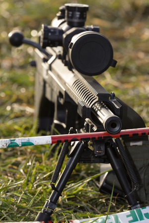 shooter aiming a rifle at a targetの写真素材