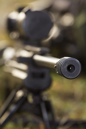 shooter aiming a rifle at a targetの写真素材