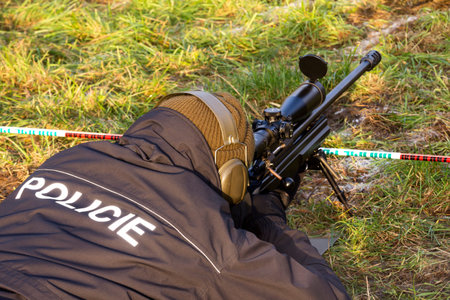 shooter aiming a rifle at a target