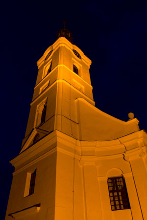 old church illuminated at nightの写真素材