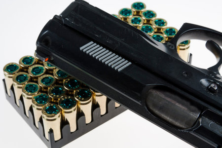 gun and bullets in the shooter's hand