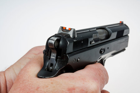 gun and bullets in the shooter's hand