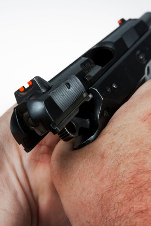 gun and bullets in the shooter's hand